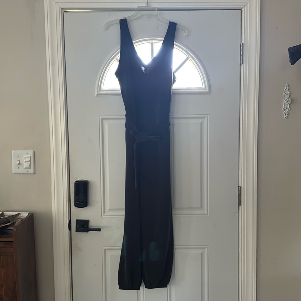 Lululemon jumpsuit with waist tie, pockets, and cinched ankles